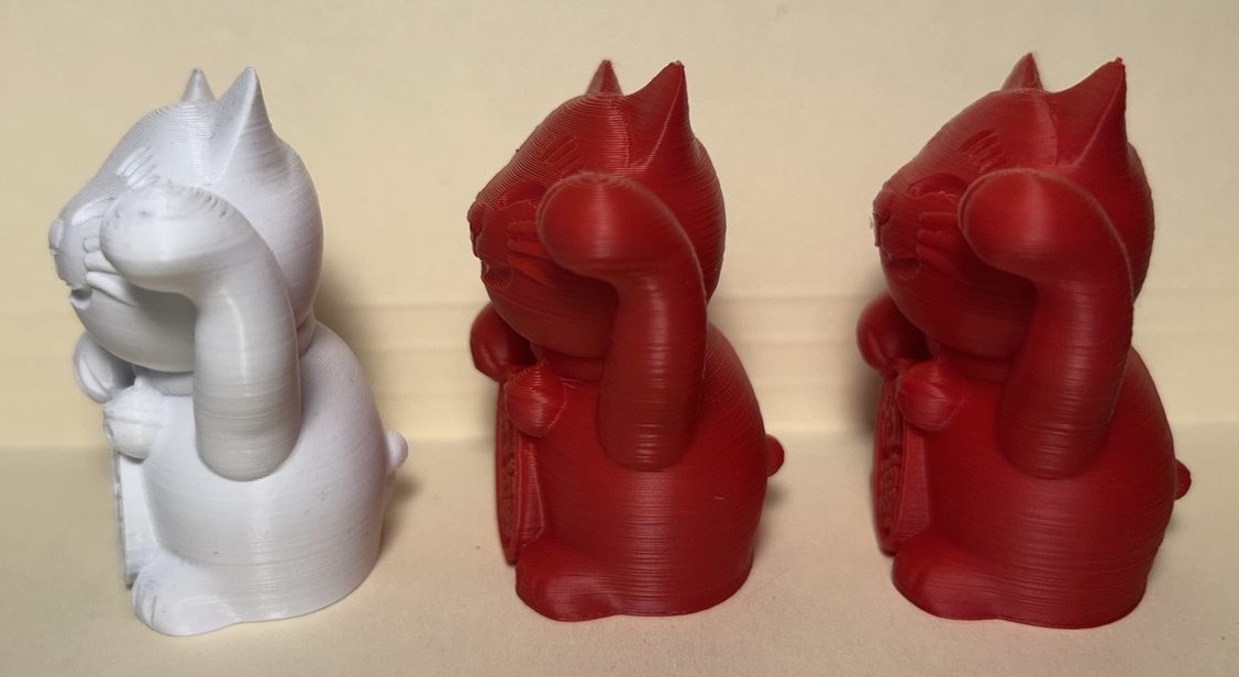 The three lucky cat prints viewed from the right